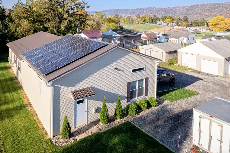 Rooftop solar array on a light-colored commercial building.